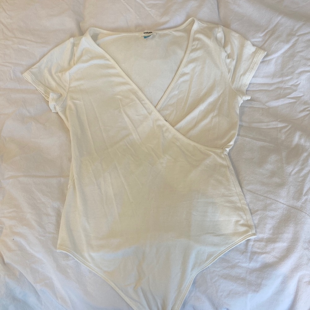 Criss cross white cream body suit